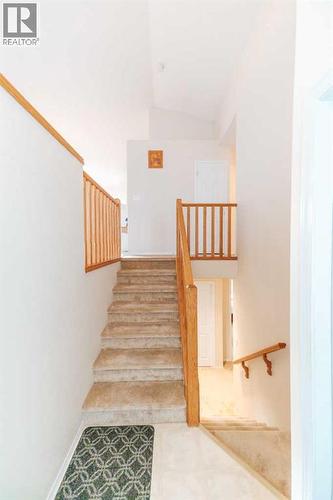 Stairs to Main Floor - 54 Kodiak Crescent N, Lethbridge, AB - Indoor Photo Showing Other Room