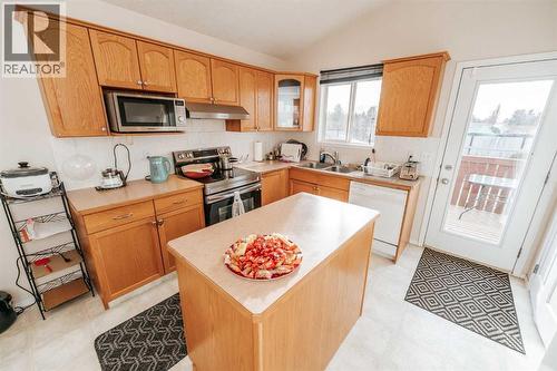 Main Floor - Kitchen - 54 Kodiak Crescent N, Lethbridge, AB - Indoor Photo Showing Kitchen With Double Sink