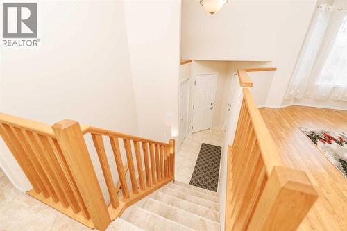 Stairs to Front and Garage - 54 Kodiak Crescent N, Lethbridge, AB - Indoor Photo Showing Other Room
