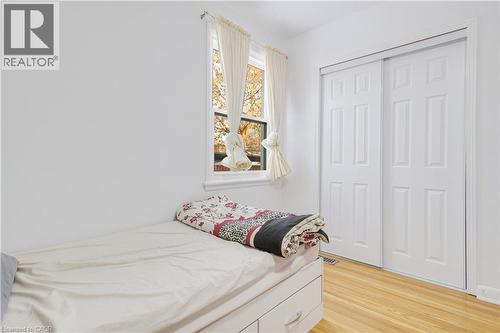 Bedroom with light wood-type flooring and a closet - 773 Queensdale Avenue E, Hamilton, ON - Indoor Photo Showing Bedroom