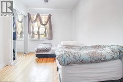 Bedroom with wood finished floors and ceiling fan - 