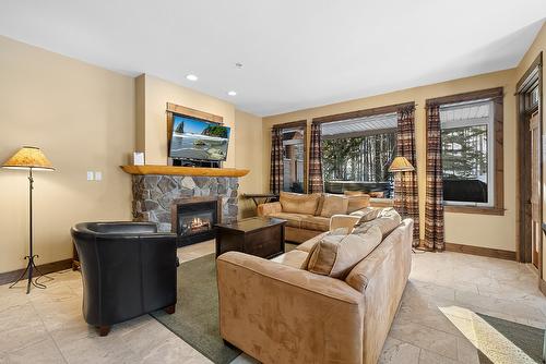 M1-A-1351 Gerry Sorensen Way, Kimberley, BC - Indoor Photo Showing Living Room With Fireplace