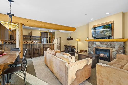 M1-A-1351 Gerry Sorensen Way, Kimberley, BC - Indoor Photo Showing Living Room With Fireplace