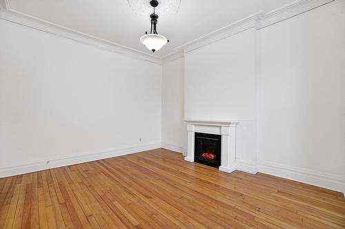 Living room - 2324 Av. Belgrave, Montréal (Côte-Des-Neiges/Notre-Dame-De-Grâce), QC - Indoor Photo Showing Other Room With Fireplace