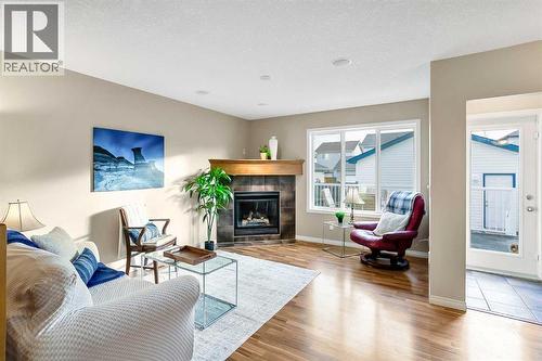 37 Silverado Saddle Avenue Sw, Calgary, AB - Indoor Photo Showing Living Room With Fireplace