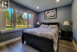 Bedroom featuring wood finished floors and recessed lighting - 