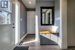 Entrance foyer with wood finished floors and recessed lighting - 