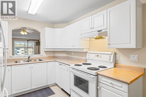 555 Houghton Road Unit# 206, Kelowna, BC - Indoor Photo Showing Kitchen With Double Sink