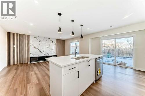936 Cranston Drive Se, Calgary, AB - Indoor Photo Showing Kitchen With Double Sink