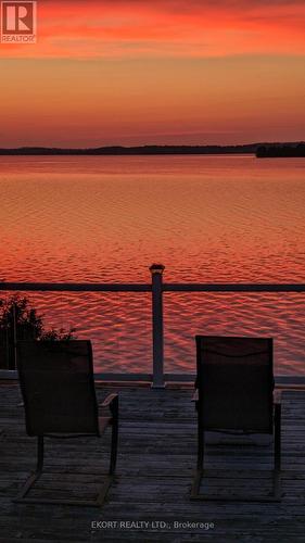 Dusk Water Views - 460 - 5427 Young Street, Hamilton Township, ON - Outdoor With Body Of Water With View