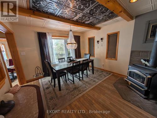 Dining Room with Wood Stove - 460 - 5427 Young Street, Hamilton Township, ON - Indoor Photo Showing Dining Room
