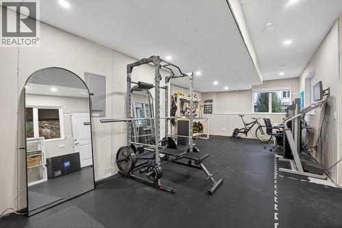 Versatile Basement Space Easily Converted Into A Bedroom, Home Office, or Rec Room - 2893 Robinson Road Unit# 5, Lake Country, BC - Indoor Photo Showing Gym Room