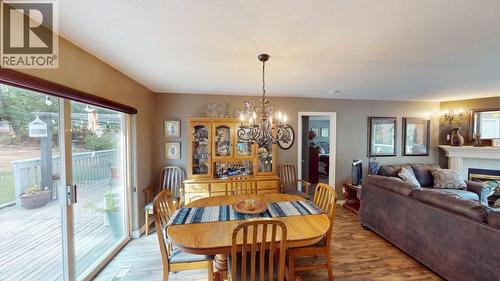 5270 Mackay Crescent, 108 Mile Ranch, BC - Indoor Photo Showing Dining Room With Fireplace