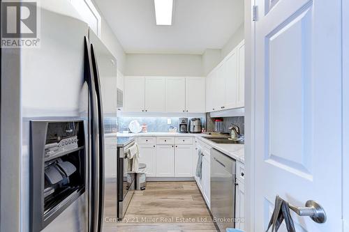 319 - 2511 Lakeshore Road W, Oakville (Br Bronte), ON - Indoor Photo Showing Kitchen With Double Sink