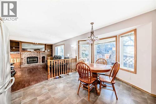 78 Sandringham Way Nw, Calgary, AB - Indoor Photo Showing Dining Room With Fireplace