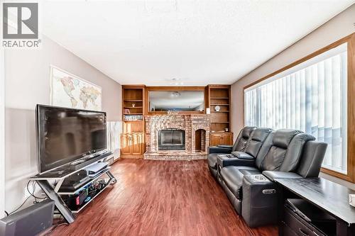 78 Sandringham Way Nw, Calgary, AB - Indoor Photo Showing Living Room With Fireplace