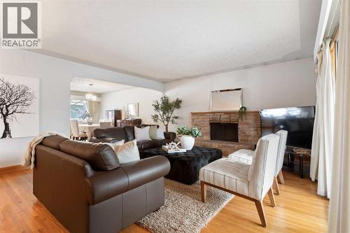 1738 Suffolk Street Sw, Calgary, AB - Indoor Photo Showing Living Room With Fireplace