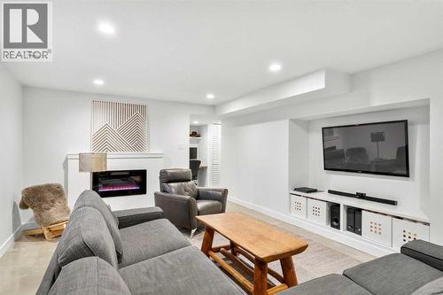 3332 Caribou Drive Nw, Calgary, AB - Indoor Photo Showing Living Room With Fireplace