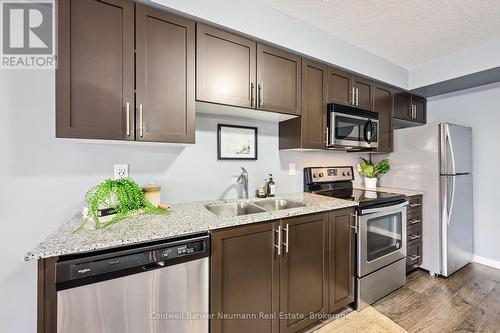 204 - 25 Kay Crescent, Guelph (Pineridge/Westminster Woods), ON - Indoor Photo Showing Kitchen With Stainless Steel Kitchen With Double Sink With Upgraded Kitchen