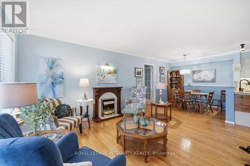 100 - 1835 Marsala Crescent, Ottawa, ON - Indoor Photo Showing Living Room With Fireplace