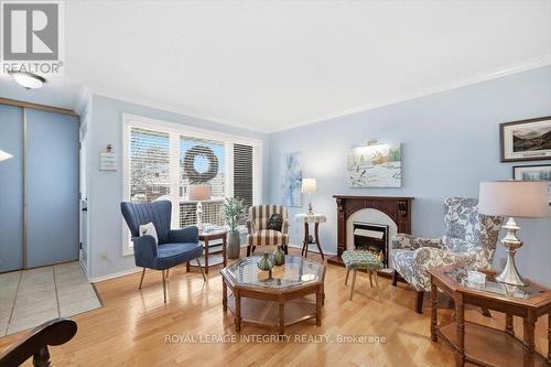 100 - 1835 Marsala Crescent, Ottawa, ON - Indoor Photo Showing Living Room With Fireplace
