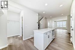 Kitchen view to Rear Entry, Mudroom & Half Bath • PLEASE NOTE: Kitchen appliances are included, and will be installed prior to possession - 