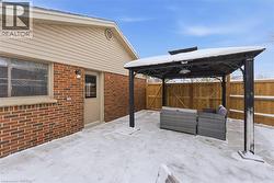 View of patio / terrace featuring a gazebo and an new concrete pad. - 