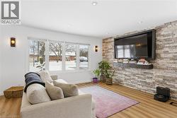 Living room with new floors and an accent wall - 