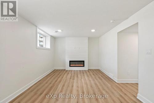 Cozy electric fireplace in Recroom - 165 Jack'S Way, Wellington North (Mount Forest), ON - Indoor With Fireplace