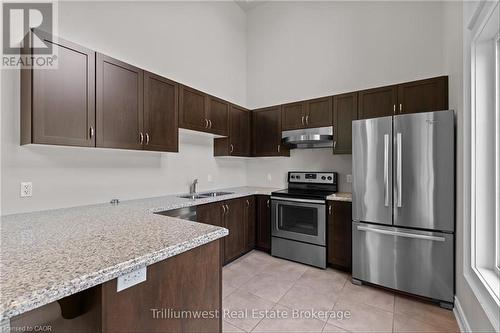 club house - 321 - 1440 Gordon Street, Guelph (Pineridge/Westminster Woods), ON - Indoor Photo Showing Kitchen With Double Sink