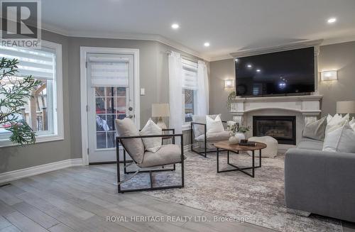 9 Sato Street, Whitby (Williamsburg), ON - Indoor Photo Showing Living Room With Fireplace