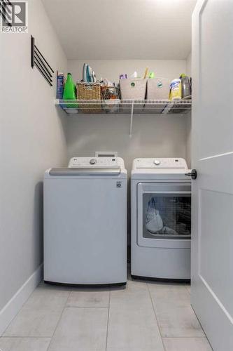 4889 7Th Street W, Claresholm, AB - Indoor Photo Showing Laundry Room