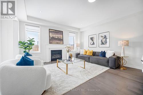 89 Barkerville Drive, Whitby, ON - Indoor Photo Showing Living Room With Fireplace