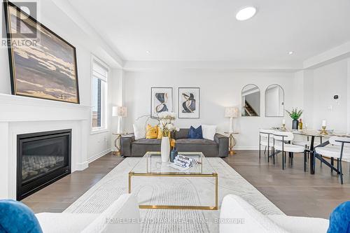 89 Barkerville Drive, Whitby, ON - Indoor Photo Showing Living Room With Fireplace