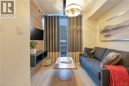 Living room featuring wood finished floors - 145 Columbia Street W Unit# 1034, Waterloo, ON - Indoor Photo Showing Living Room