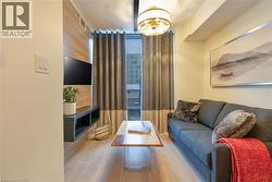 Living room featuring wood finished floors - 