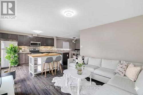 virtually staged kitchen island - 1855 Maple Grove Road, Ottawa, ON - Indoor Photo Showing Living Room