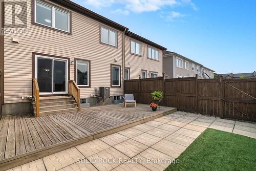with patio stones, deck, and artificial turf. - 1855 Maple Grove Road, Ottawa, ON - Outdoor With Exterior
