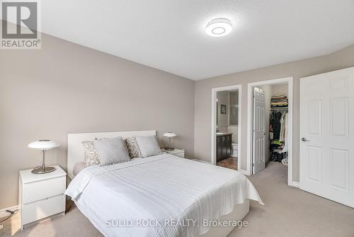 The primary bedroom offers a walk-in closet - 1855 Maple Grove Road, Ottawa, ON - Indoor Photo Showing Bedroom