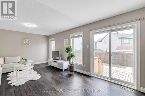 Facing the backyard with no maintenance required - 1855 Maple Grove Road, Ottawa, ON - Indoor Photo Showing Living Room
