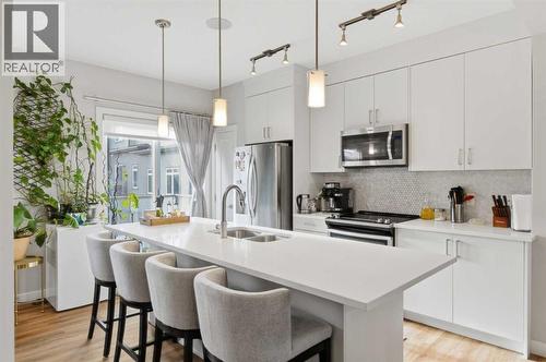 95 Sage Bluff Gate Nw, Calgary, AB - Indoor Photo Showing Kitchen With Stainless Steel Kitchen With Double Sink With Upgraded Kitchen