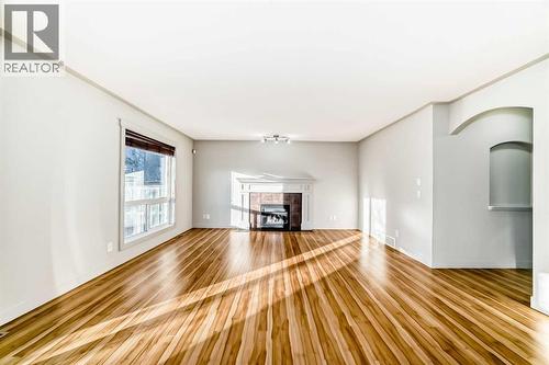 1156 Sherwood Boulevard Nw, Calgary, AB - Indoor With Fireplace