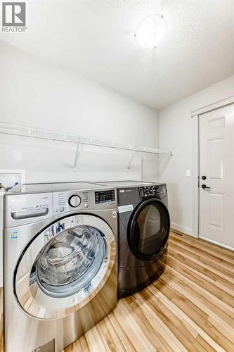 1156 Sherwood Boulevard Nw, Calgary, AB - Indoor Photo Showing Laundry Room