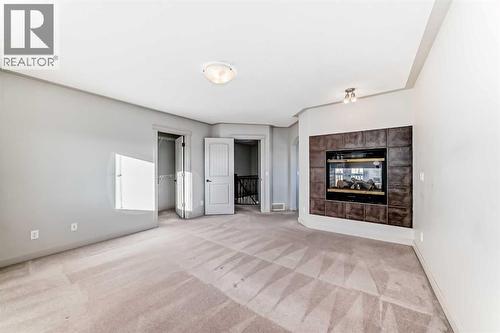 1156 Sherwood Boulevard Nw, Calgary, AB - Indoor With Fireplace