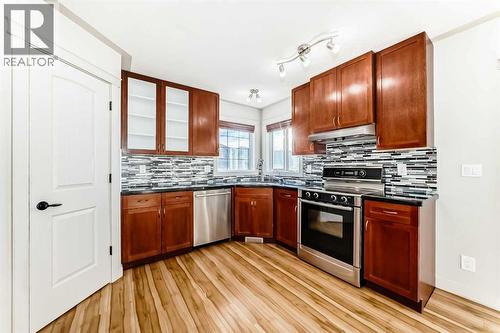 1156 Sherwood Boulevard Nw, Calgary, AB - Indoor Photo Showing Kitchen With Double Sink
