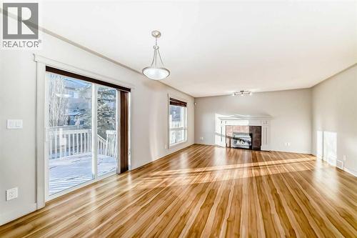 1156 Sherwood Boulevard Nw, Calgary, AB - Indoor Photo Showing Other Room With Fireplace