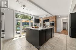 Eat-in breakfast bar, lots of natural light. - 