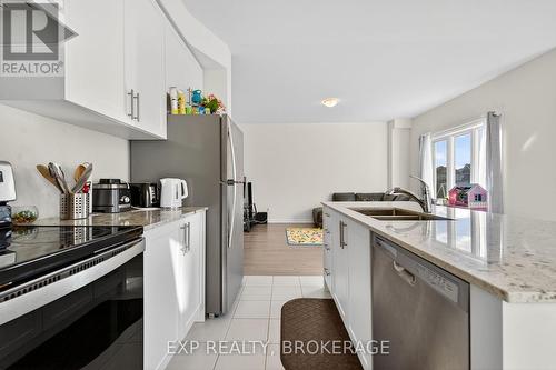 73 Oakmont Drive, Loyalist (Bath), ON - Indoor Photo Showing Kitchen With Double Sink