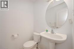 Half bath with toilet and baseboards - 