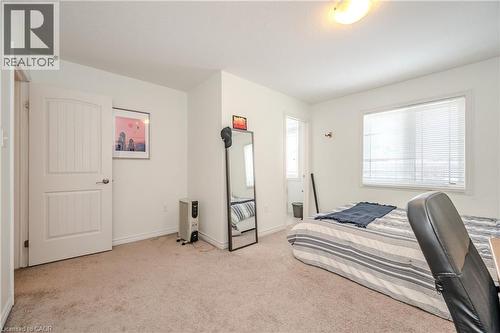 Carpeted bedroom with baseboards - 23 Kingsbury Square Unit# 23, Guelph, ON - Indoor Photo Showing Bedroom
